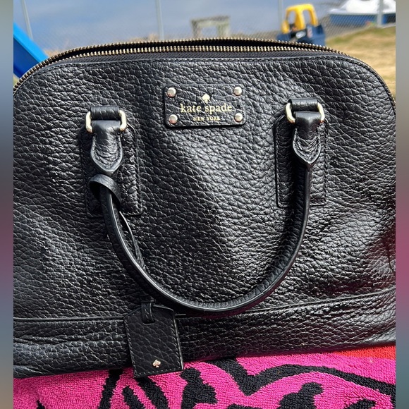 Kate Spade purse in great condition. The color is black. It has a strap. - Picture 2 of 3